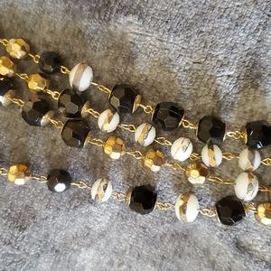 Black, gold, white long bead necklace